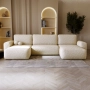 Bouclé U-Sofa mit Schlaffunktion & runden Formen Ornello U